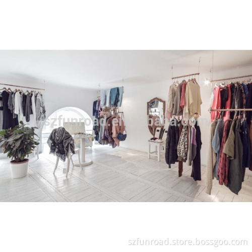 Unique wood checkout counters and display cases for clothing store interior design